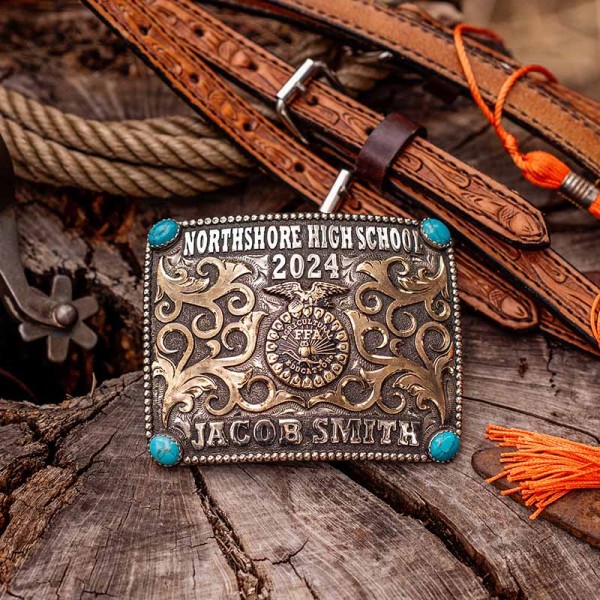 A custom belt buckle for Northshore High School with personalized name featuring turquoise stones and the FFA logo